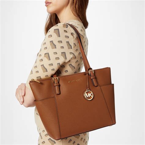 michael kors strandbags|Michael Kors travel tote bag.